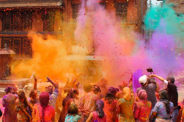 Bhaktapur, Nepal - March 12, 2014: Group of people celebrating the festival of colors Holi which is very famous in Nepal and India